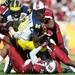 Michigan quarterback Devin Gardner is pulled down by South Carolina defense after loosing his helmet in the second quarter against South Carolina in the Outback Bowl in Tampa, Fla. on Tuesday, Jan. 1. Melanie Maxwell I AnnArbor.com